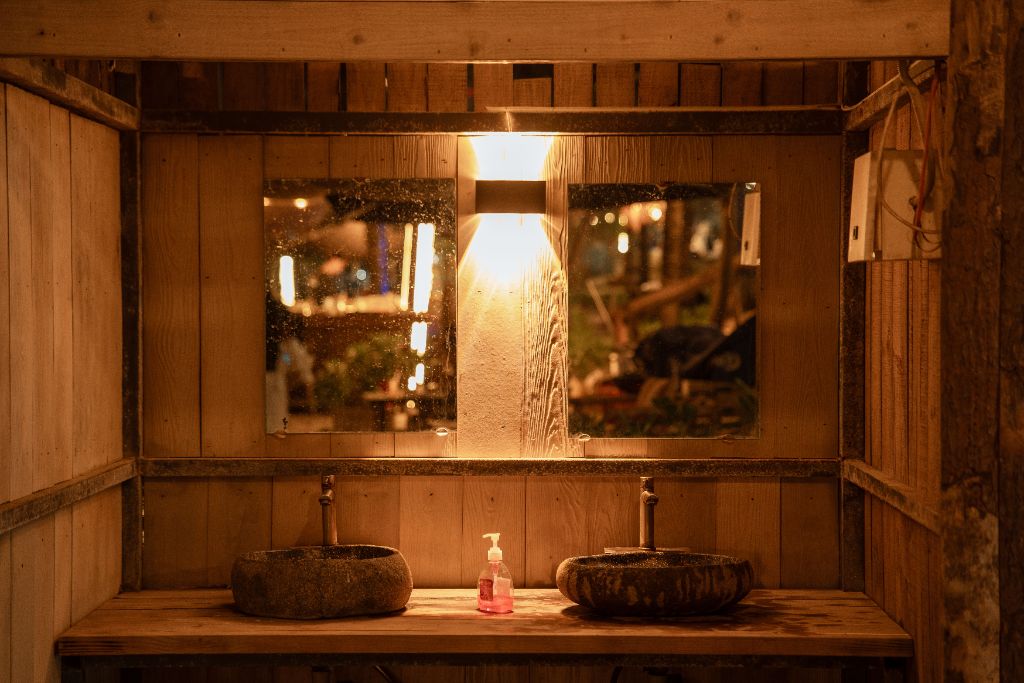 Rustic stone basin bathroom with warm wooden interior